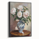 Framed canvas artwork displaying an abstract floral design in vibrant colors, with a sleek black frame, showcasing a modern aesthetic perfect for home decor.