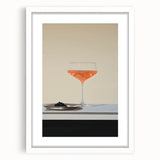 Abstract art print featuring swirling patterns in muted grays and blues, framed with a white mat.