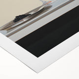 Art deco poster featuring a stylized cocktail glass, in black and gold tones on rolled canvas.