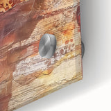 Large abstract wall art depicting autumnal trees in orange and red tones on acrylic glass.