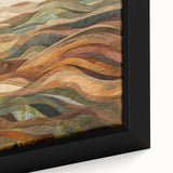 Close-up of a textured black wall art piece featuring colorful, abstract fall motifs on a framed canvas.