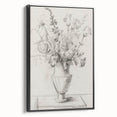 Framed canvas artwork showcasing vibrant abstract florals in shades of pink, blue, and green, presented in a sleek black frame, ideal for modern home decor.