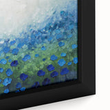 Close-up of a framed canvas artwork showcasing vibrant abstract floral designs in bold colors, perfect for modern home decor, adding a touch of elegance and creativity to any space.