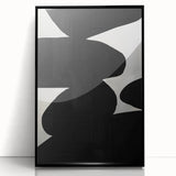 Framed abstract minimalist wall art featuring bold black shapes on a white background, ideal for modern decor, showcased from a front view, emphasizing its sleek design and contemporary style.