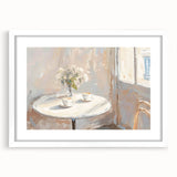 Abstract art print featuring swirling patterns in muted gray and blue tones, framed with a white mat.