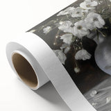 Abstract floral design on rolled canvas featuring vibrant colors of pink, blue, and green. Perfect for modern home decor, it comes securely packaged in a cardboard tube.