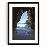 Framed landscape artwork depicting a cave scene, featuring a black mat and sleek frame design. Ideal for home decor, adding a modern touch to any space.