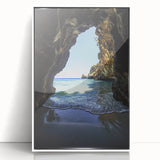 Framed acrylic landscape artwork showcasing a serene cave scene with vibrant colors, set against a white backdrop, perfect for contemporary home decor.