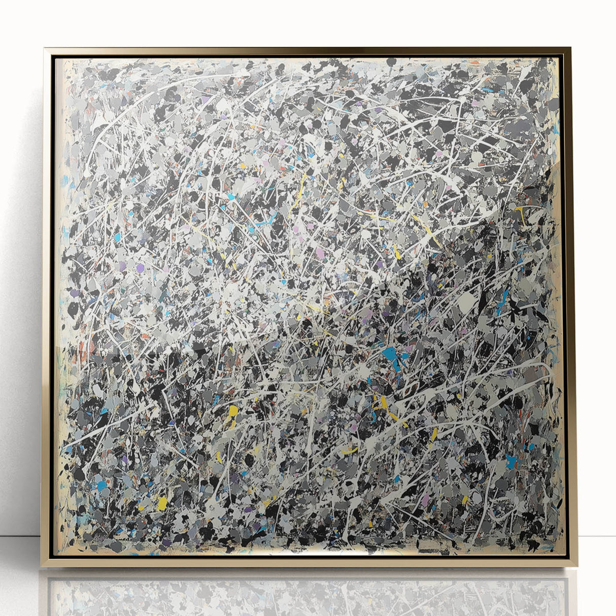 Framed abstract art piece featuring colorful splatters in vibrant hues of gold, blue, and red, set against a sleek acrylic background, perfect for modern decor.