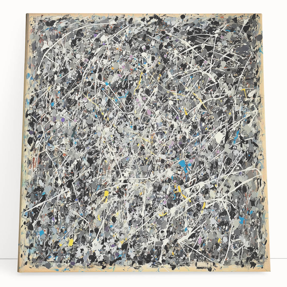 Abstract splatter art on stretched canvas, showcasing vibrant colors like blue, orange, and yellow; perfect for modern home decor or artistic spaces.