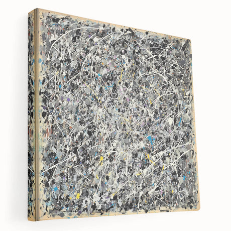 Abstract splatter art on stretched canvas showcasing vibrant colors and dynamic shapes, ideal for modern home decor. Side view highlights depth and texture.
