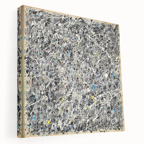 Abstract splatter art on stretched canvas showcasing vibrant colors and dynamic shapes, ideal for modern home decor. Side view highlights depth and texture.