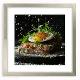 Textured abstract art print in muted gray and blue tones, framed in silver, ideal for modern bedroom ambiance.