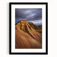 Framed desert landscape artwork with a black mat and sleek black frame, showcasing warm earthy tones and vast skies, perfect for home decor.
