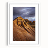 Elegant desert landscape framed in white matting, showcasing warm tones of orange and brown. This artwork enhances modern decor with its serene ambiance.