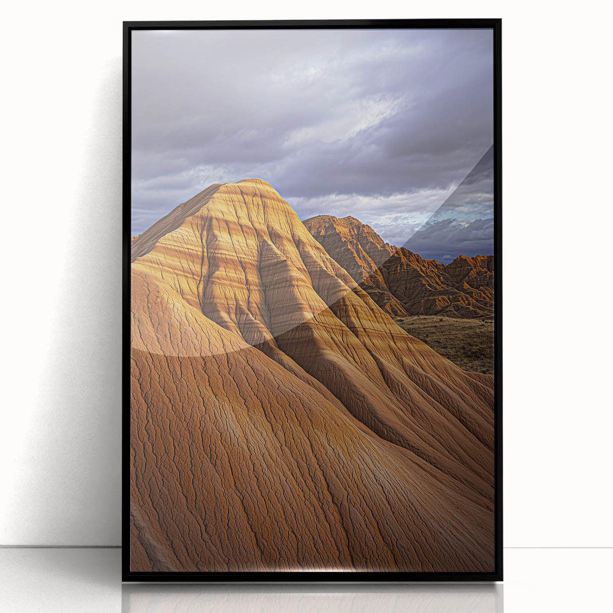Framed acrylic artwork showcasing a serene desert landscape in vibrant colors, featuring a black frame that enhances the visual appeal. Perfect for modern home decor.