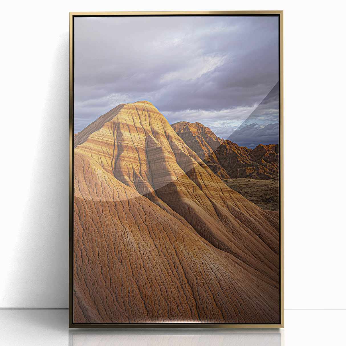 Framed acrylic artwork showcasing a desert landscape with vibrant gold accents, designed for modern decor. Perfect for enhancing living spaces or offices.