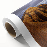 Desert landscape rolled canvas art showcasing vibrant orange and yellow hues of a sunset over sand dunes, elegantly packaged in a protective cardboard tube for easy transport and display.