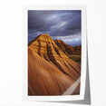 Desert landscape rolled print showcasing vibrant hues of orange and gold, depicting a serene sunset over sand dunes, elegantly packaged in a protective cardboard tube.