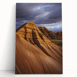 Desert landscape stretched canvas art featuring warm hues of orange and beige, depicting rolling dunes under a vibrant sunset, perfect for home decor.