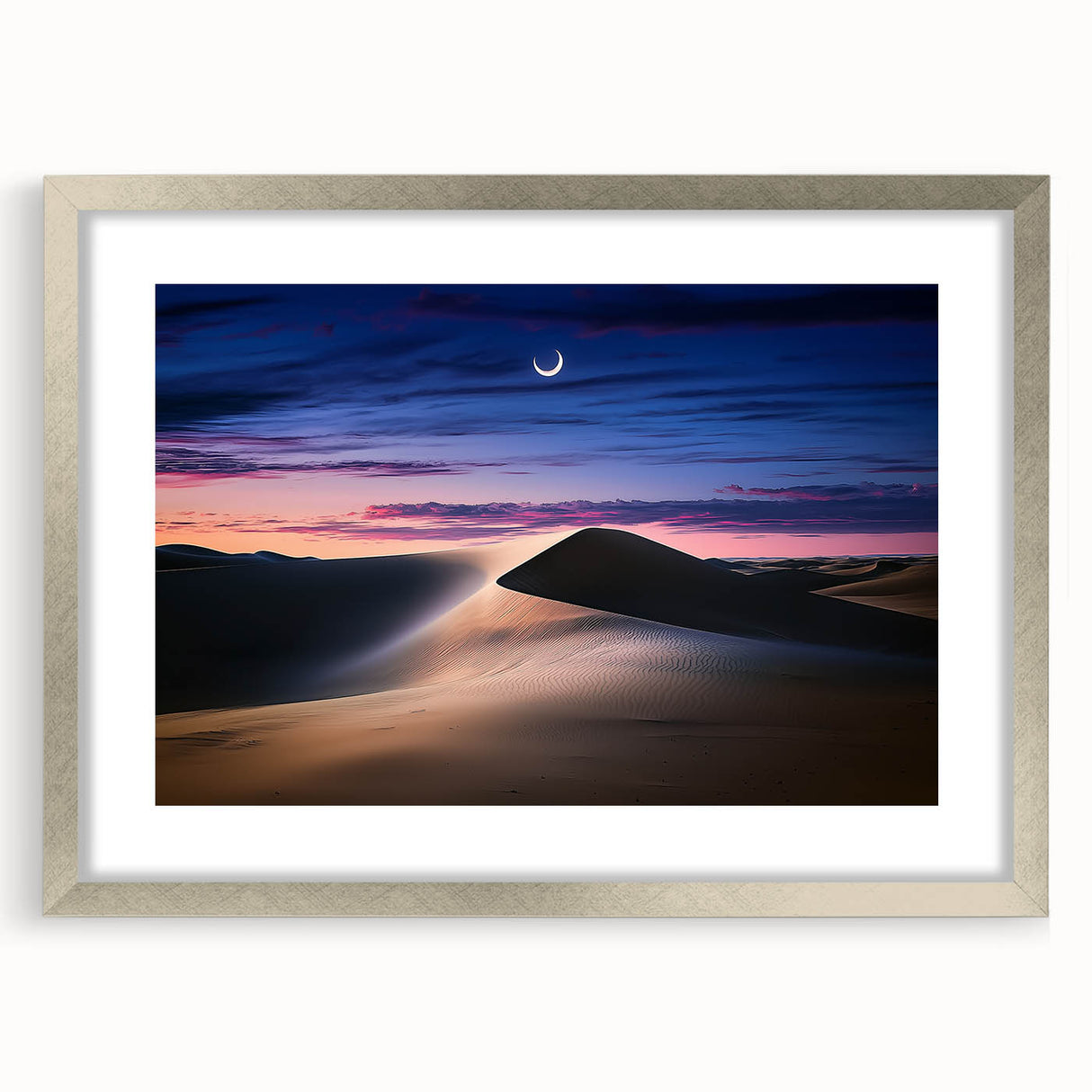Silver-framed landscape artwork showcasing serene sand dunes, accented with a white mat for an elegant presentation, ideal for modern home decor.