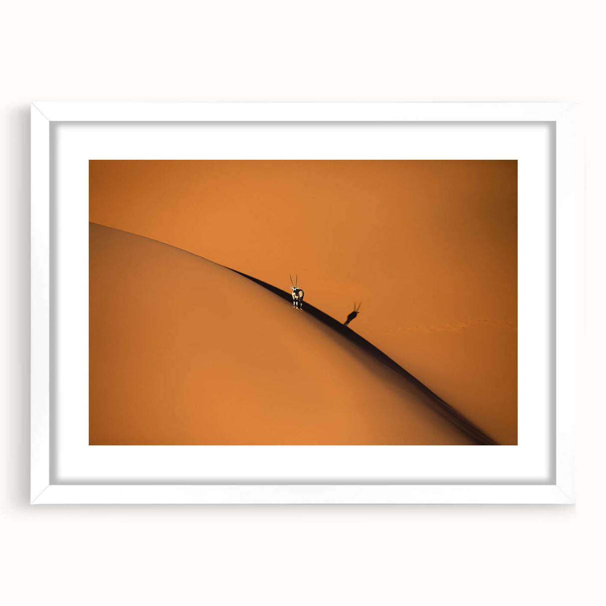 Extra large abstract art print depicting textured African scenery in earth tones, framed with a white mat.