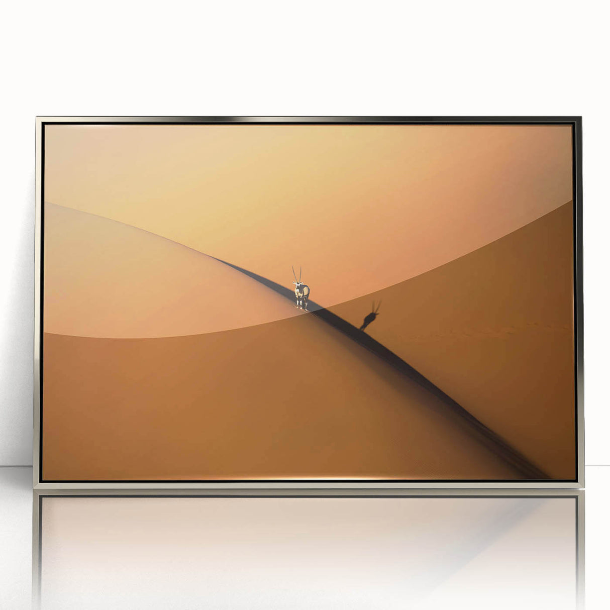 Acrylic print of a Namibian landscape in muted earth tones, framed in silver, suitable for modern art wall decor.
