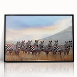 Large abstract wall art featuring a Tanzanian landscape in muted earth tones, framed in black acrylic.