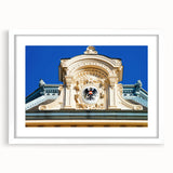 Textured abstract art print of a European landscape in muted earth tones, framed in white, suitable for bedroom decor.