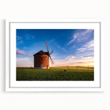 Abstract art print of a European cityscape in muted gray and blue tones on a framed white mat, ideal for dining room decor.