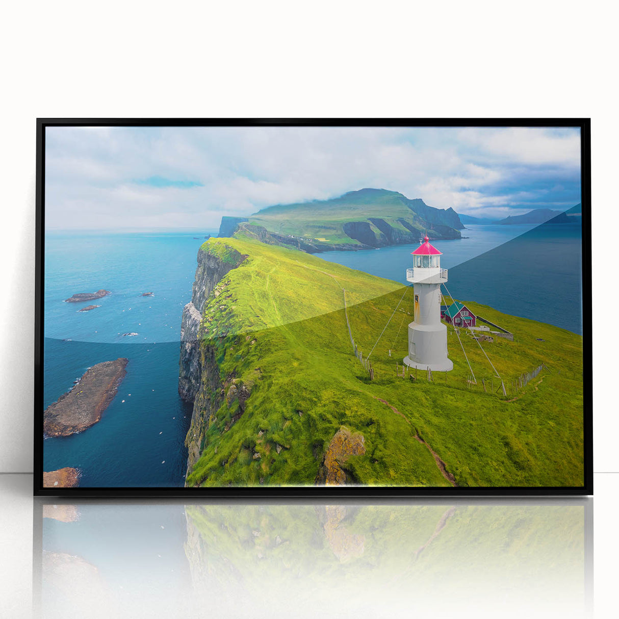 Large abstract wall art depicting a serene European landscape in muted blue and green tones, acrylic print in a black frame.