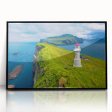 Large abstract wall art depicting a serene European landscape in muted blue and green tones, acrylic print in a black frame.