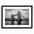 Extra large abstract art print of a colorful London skyline on textured canvas, framed in black, ideal for living room decor.