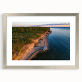 Extra large abstract art print of a European cityscape in muted grays and blues, framed in silver.