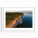 Textured abstract art print depicting a serene European landscape in muted green and blue tones, framed with a white mat.