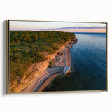 Framed canvas wall art featuring a vintage-style landscape of an Estonian scenery in muted gold and black tones.