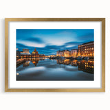 Abstract art print of a serene Finnish landscape in muted blues and greens, framed in gold.