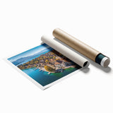 Rolled print of the French Alps with vibrant green meadows and snow-capped mountains, ideal for classy bathroom wall art.