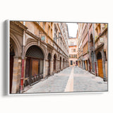 Vintage poster art of Lyon, France in vibrant colors on a large framed canvas, ideal for living room decor.