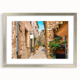 Extra large abstract art print of a textured European scenery in muted earth tones, framed in silver.