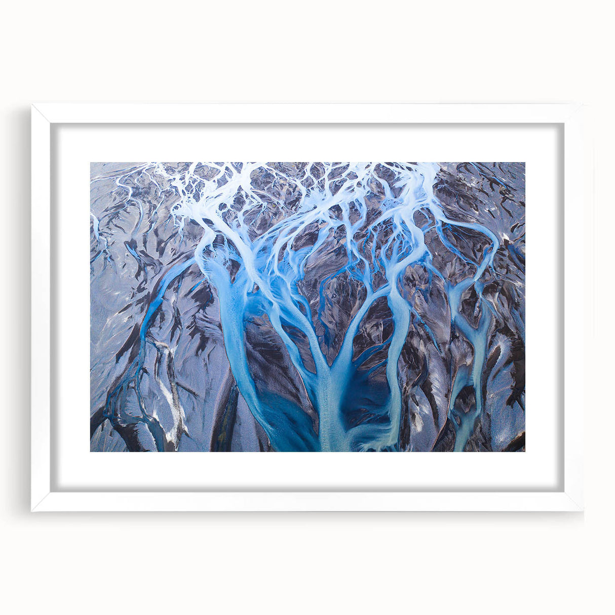 Abstract art print of an Icelandic landscape in muted gray and blue tones on a framed white mat, ideal for dining room decor.