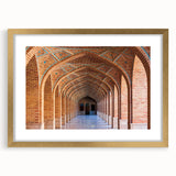 Extra large framed wall art depicting an abstract scenery in gold and beige tones, ideal for living room ambiance.