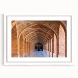 Abstract art print depicting Middle Eastern scenery in muted earth tones on a white framed mat.