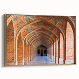 Framed canvas featuring a vintage landscape painting of a Middle Eastern scenery in gold and black tones.