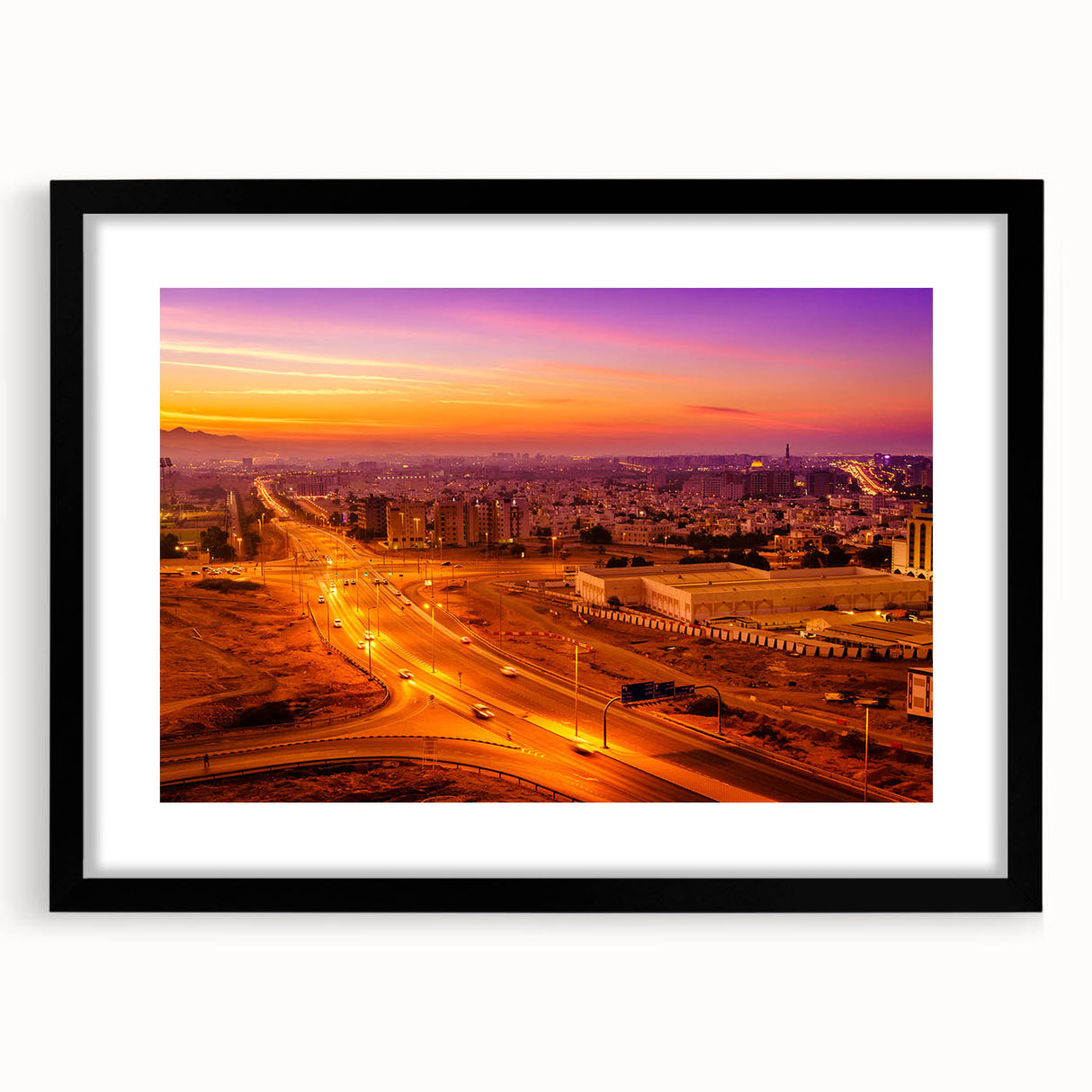 Abstract art print featuring vibrant, colorful textures representing a Middle Eastern scenery, framed in black.