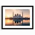 Colorful abstract art print of textured scenery, in a large black frame, suitable for living room decor.