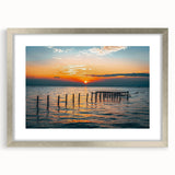 Textured abstract art print of Alabama scenery in muted earth tones on a framed silver mat, suitable for bedroom decor.