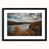Extra large abstract art print featuring colorful, textured scenery of Arkansas, in a black frame with mat.
