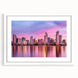 Abstract art print depicting the San Diego skyline in muted blue and gray tones, framed with a white mat.