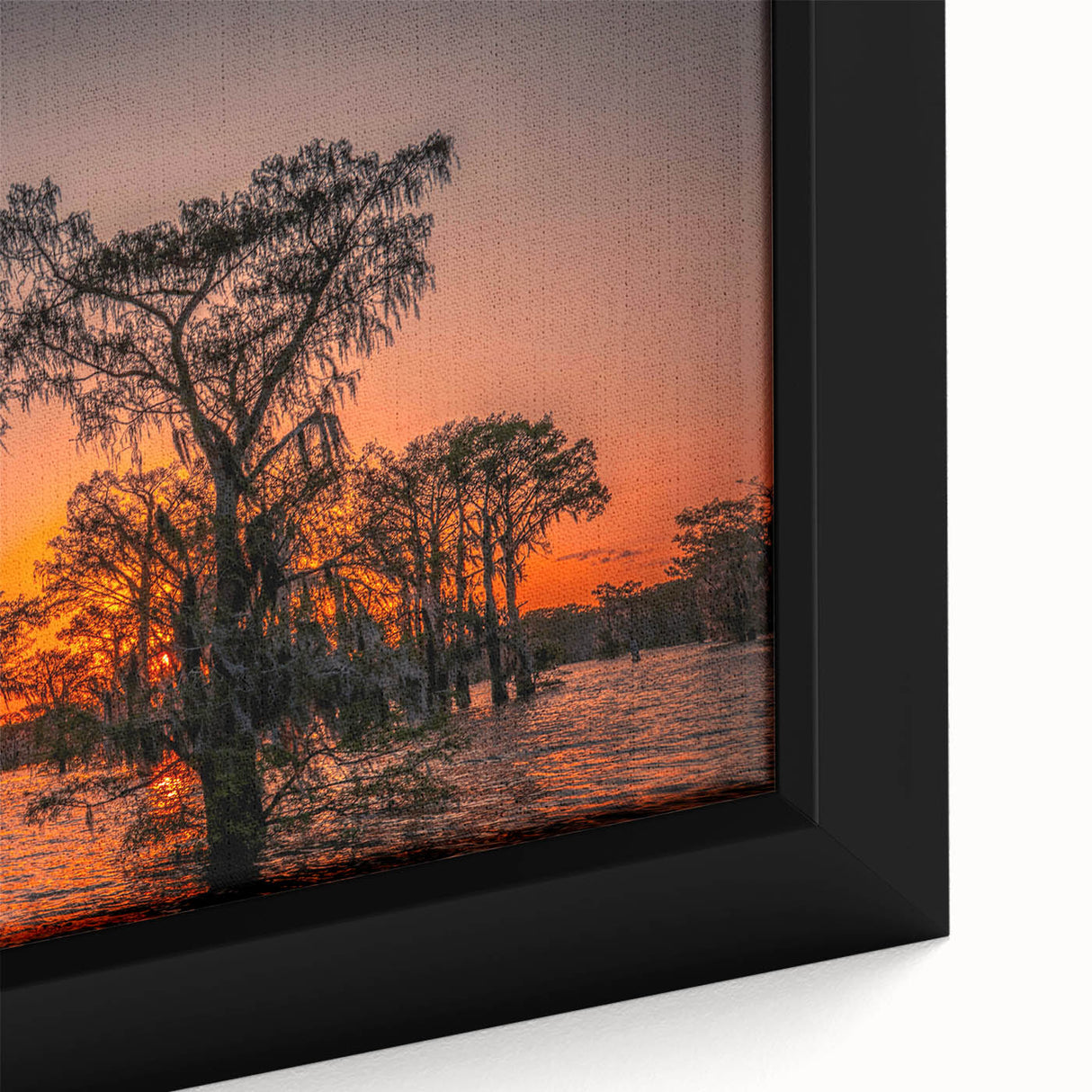 Close-up of a textured, extra-large framed canvas depicting a colorful Louisiana scenery in black with vibrant accents.